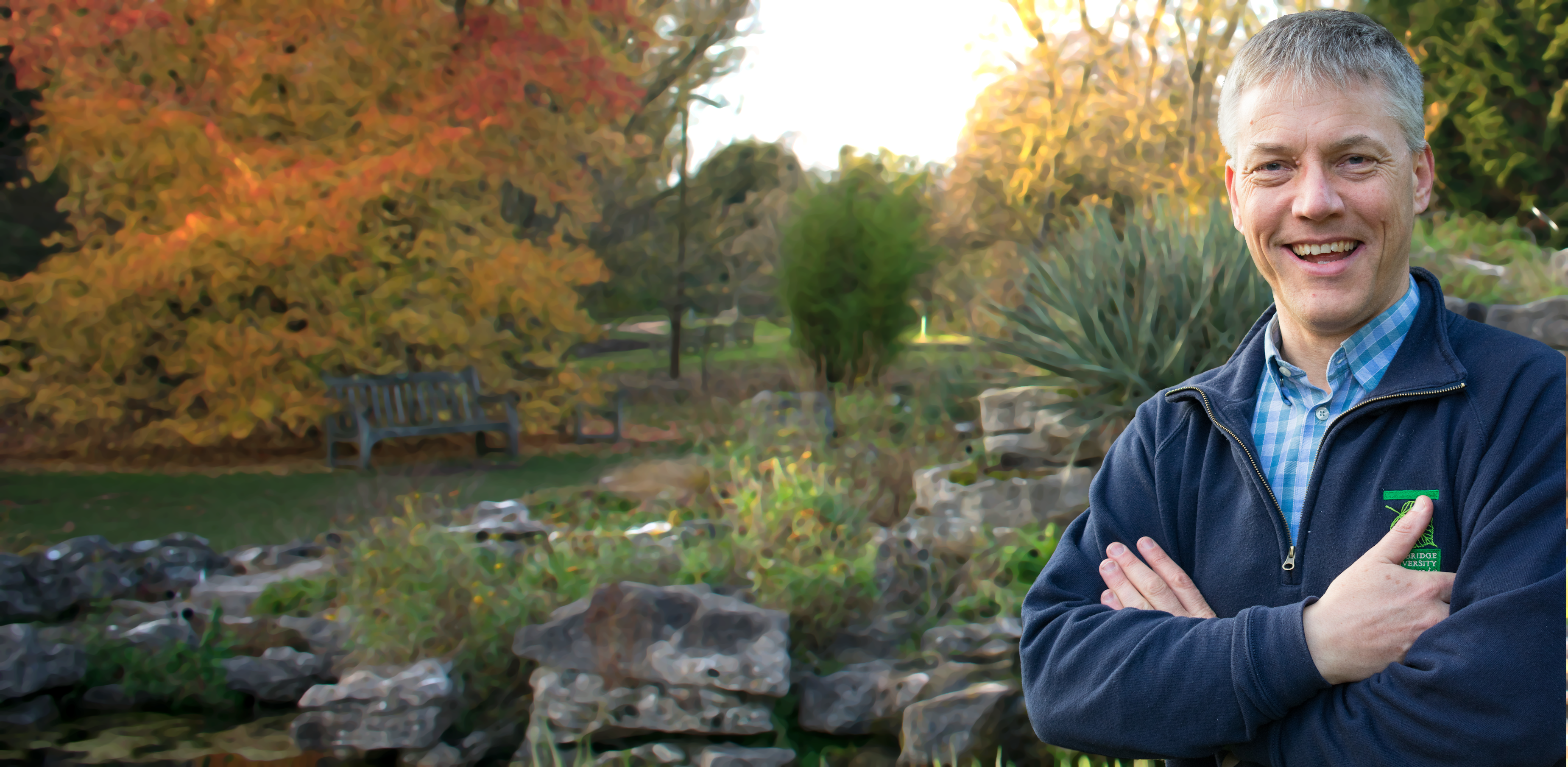 David Coomes in blue fleece in a garden 