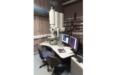 microscope Tecnai G2 TEM on table next to computer