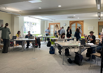 people sitting at tables in a room