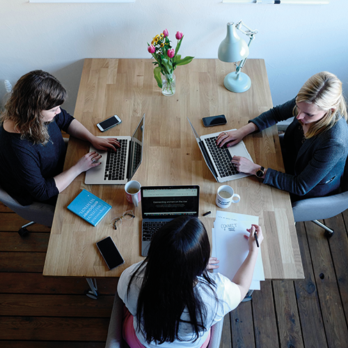 Research Fellows: Support and Development women sitting at desk with laptops
