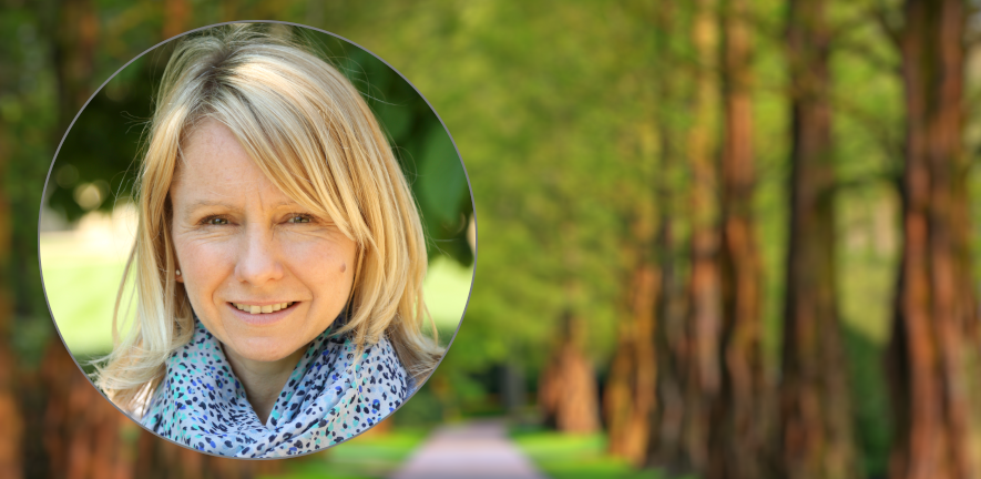 Kathryn Chapman, credit: Mabel amber, who will one day from pixabay A profile of Kathryn chapman wearing a scarf against a blurred background of a green park