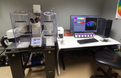 microscope Leica SP8 confocal on table next to computer