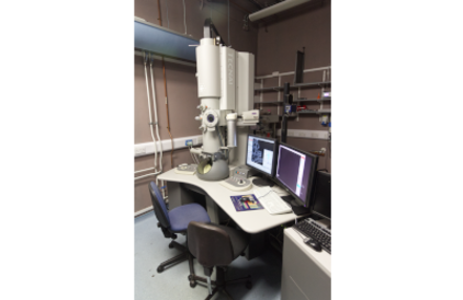 microscope Tecnai G2 TEM on table next to computer