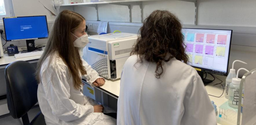 Flow Cytometry Credit: Department of Pathology two people working with lab equipment