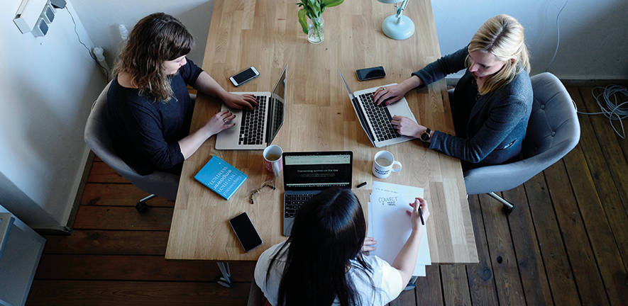 Research Fellows: Support and Development 3 women sitting at a table working on laptops
